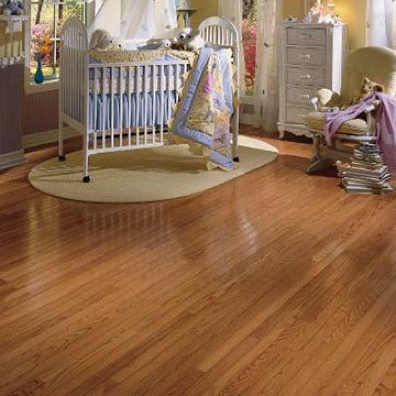 Light brown hardwood floor in bedroom